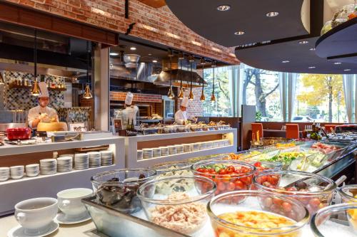 a buffet line with many different types of food at Sapporo View Hotel Odori Park in Sapporo