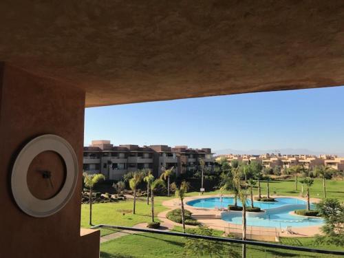a view of a resort with a swimming pool at Prestigia Golf City Apartment in Marrakesh