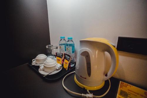 a coffee maker sitting on a counter in a room at Butuan Grand Palace Hotel in Butuan