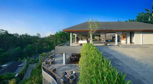 an overhead view of a building with tables and chairs at Samsara Ubud in Ubud