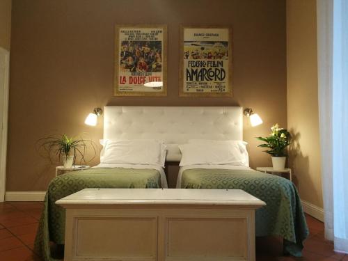 En eller flere senge i et værelse på Bed & Breakfast Morelli 49