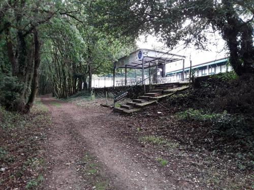 a train station with stairs next to a dirt road at Hotel Castro in Santiago de Compostela