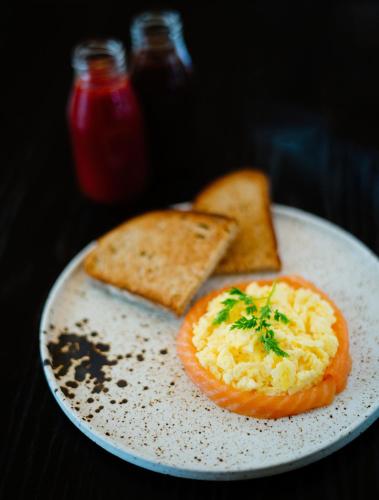 a plate of food with a tomato and toast at Hotel Du Vin Poole in Poole