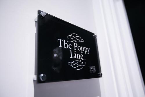 a sign that reads theory line on a wall at Apartments at Number 10 The Abbey in Norwich