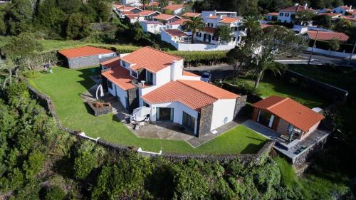 an aerial view of a house on a hill at Vale Dos Milhafres in Angra do Heroísmo