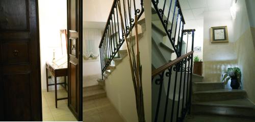 a staircase in a house with a stair railing at CityHotel Cristina Vicenza in Vicenza
