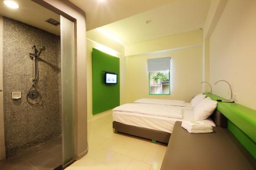 Postel nebo postele na pokoji v ubytování POP! Hotel Sangaji Yogyakarta