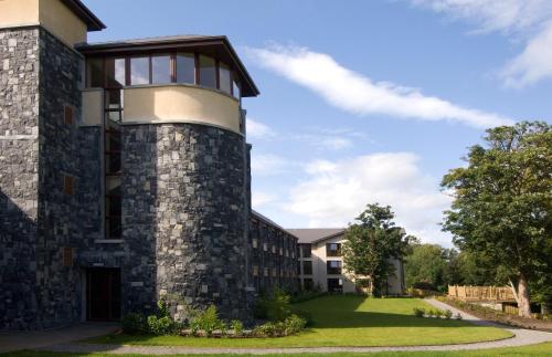 a large brick building with a large window at Westport Woods Hotel & Spa in Westport