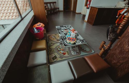 an overhead view of a living room with a table and chairs at Hotel Albergaria Senhora do Espinheiro in Seia
