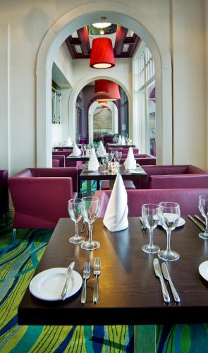 a dining room with a table with wine glasses on it at The Landmark Hotel in Carrick on Shannon