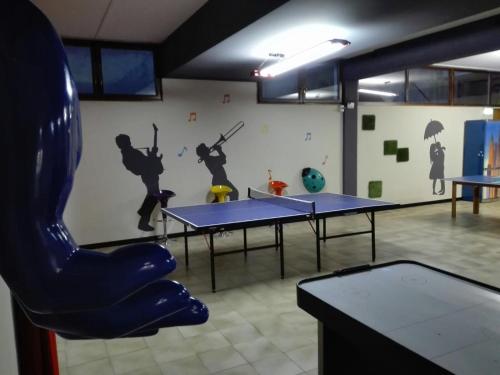 a ping pong room with two ping pong tables at Hotel Valpolicella International in San Pietro in Cariano