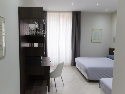 Postel nebo postele na pokoji v ubytování Venustas Roma Hotel