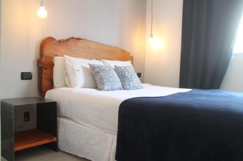 Ένα ή περισσότερα κρεβάτια σε δωμάτιο στο Hotel Florinda