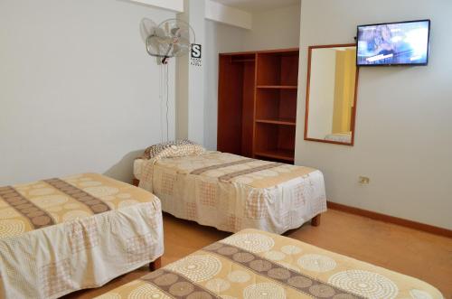 Ліжко або ліжка в номері Primavera Plaza Hotel