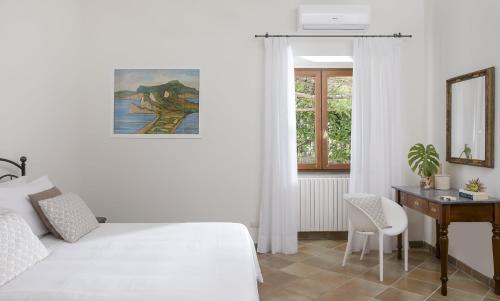 Tempat tidur dalam kamar di Villa Caprile