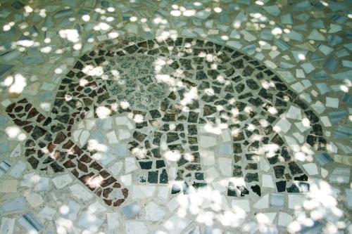 a mosaic tile floor in a bathroom with at George Apartments in Livadia
