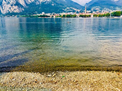 a body of water with a town in the background at I Bravi in Malgrate