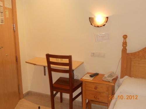 Postel nebo postele na pokoji v ubytování Hostal Restaurante Hermanos Zamora
