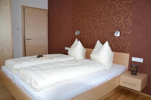 Posteľ alebo postele v izbe v ubytovaní Appartements Aurora