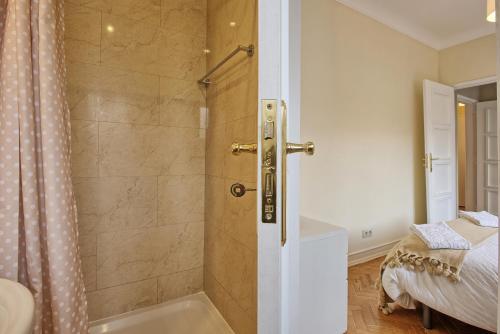 a bathroom with a shower with a bath tub at Almirante Top Floor / Almirante Reis Avenue in Lisbon