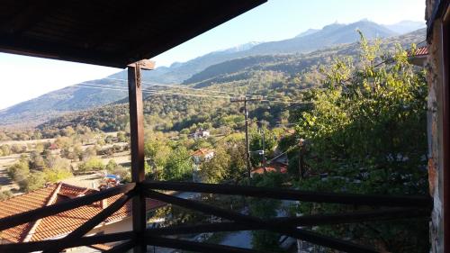 a view of the mountains from the balcony of a house at Stonehouse 2 Bedroom Chalet on Olympus Amazing View in Pétra