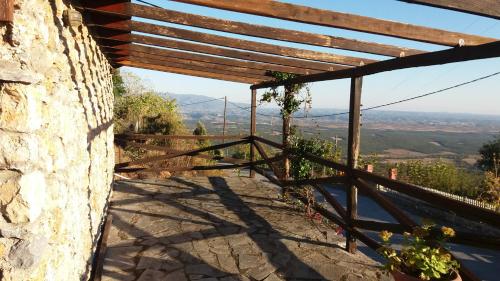 a stone wall with a view of a mountain at Stonehouse 2 Bedroom Chalet on Olympus Amazing View in Pétra