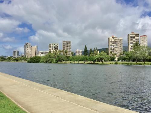 a view of a river with a city in the background at Holiday Surf Hotel (with full kitchen) in Honolulu