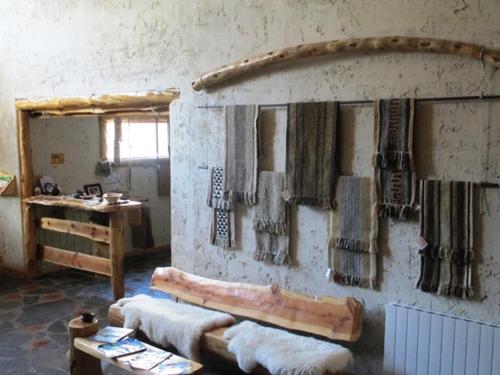 a room with a wall with mats on the wall at Ruca Pehuen Eco-Lodge De Montaña in Caviahue