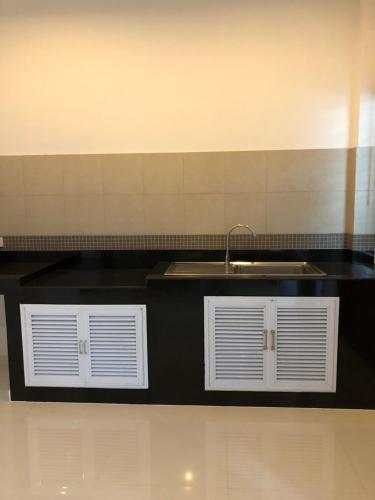 a kitchen counter with a sink and a sink at Samui Paca place in Mae Nam