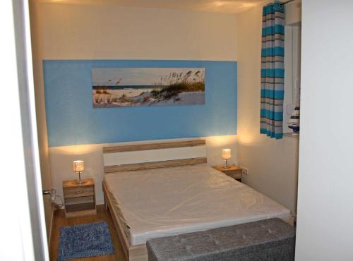 Ένα ή περισσότερα κρεβάτια σε δωμάτιο στο Ferienwohnungen Luetow USE 3100