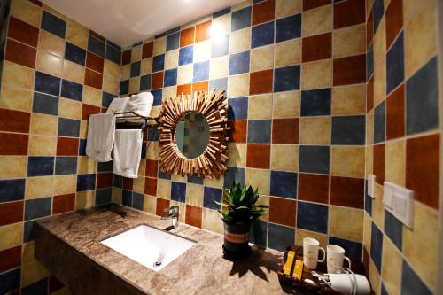 a bathroom with a sink and a mirror at T&T Story Hotel (Xi Gong Pier) in Kunming