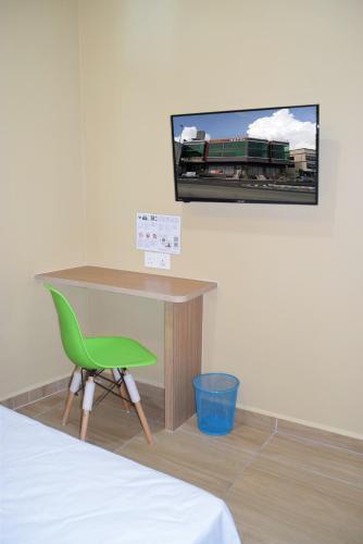 TV a/nebo společenská místnost v ubytování Asiago Hotel
