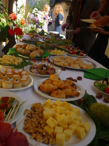 a table with many plates of food on it at Da Erminia in Verdabbio