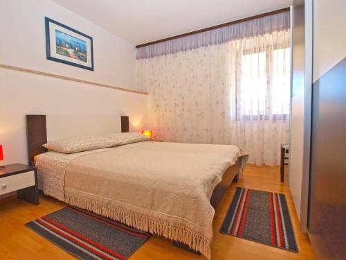 Postel nebo postele na pokoji v ubytování Apartments Blazenka 1270