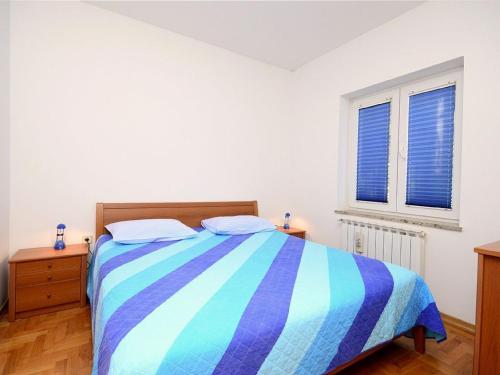 Postel nebo postele na pokoji v ubytování Apartment Blazenka 1154
