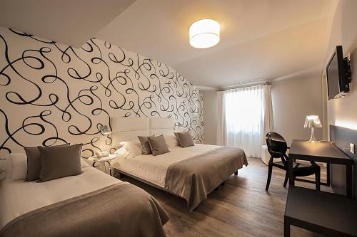 Postel nebo postele na pokoji v ubytování Hotel Monte Meraviglia