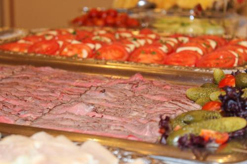 a display of meat and other fruits and vegetables at Landhotel Hermannshöhe in Legden