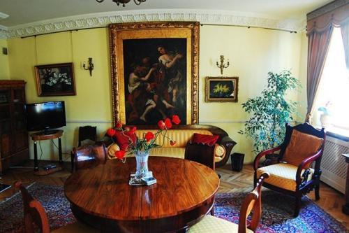 a living room with a table and a couch at Royal in Kraków