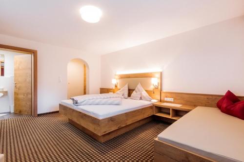 Ένα ή περισσότερα κρεβάτια σε δωμάτιο στο Apart Madeleine Superior inklusive Summercard