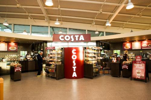 a store with a coca cola sign in a mall at Days Inn Cannock - Norton Canes in Cannock