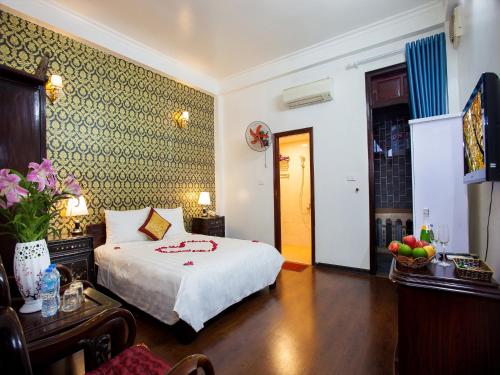Posteľ alebo postele v izbe v ubytovaní Phuong Trang Hotel