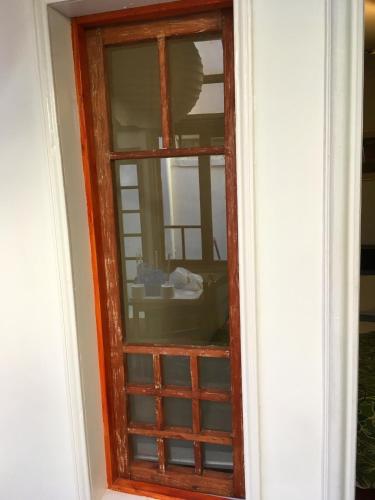 a door with a window in a room at Tralkan B&B in Santiago
