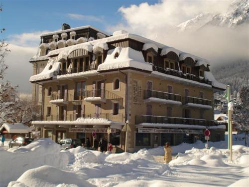 
a large building with skis on top of it at Quartz-Montblanc in Chamonix
