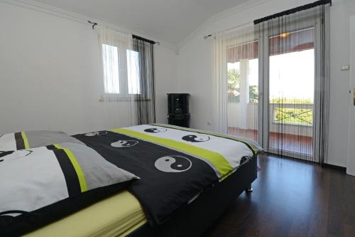 a bedroom with a bed with a skull and crossbones at Villa Zare in Poreč