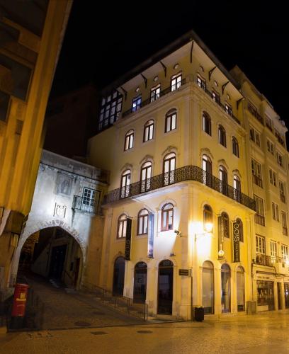 a large building with a balcony on the side of it at Orpheus - Miguel Torga - UNESCO Heritage in Coimbra