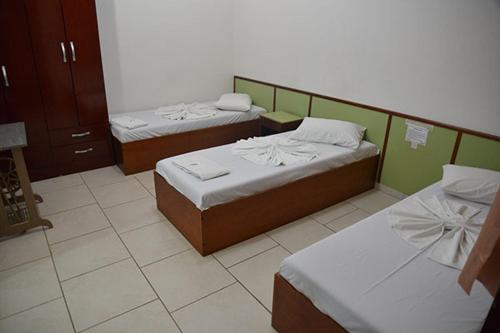 En eller flere senge i et værelse på Unihotel