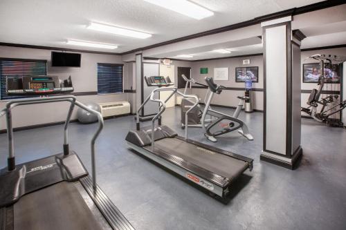 a gym with two tread machines and a treadmill at Baymont by Wyndham Canton in Canton