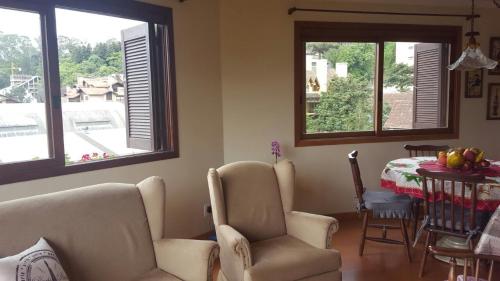 Predel za sedenje v nastanitvi Apartamento Gramado