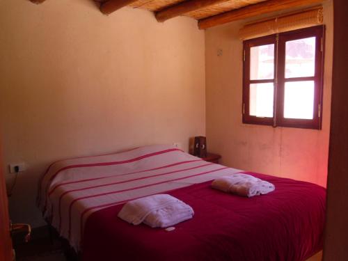 En eller flere senger på et rom på Casas de Juella
