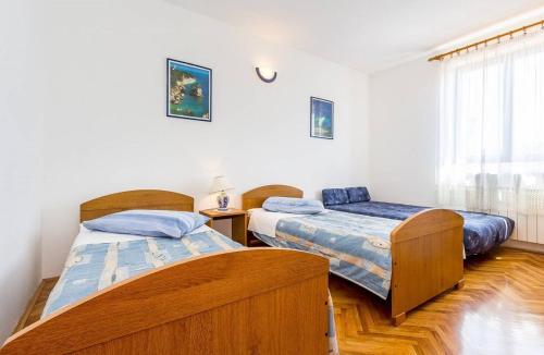 Postel nebo postele na pokoji v ubytování Apartments Winny